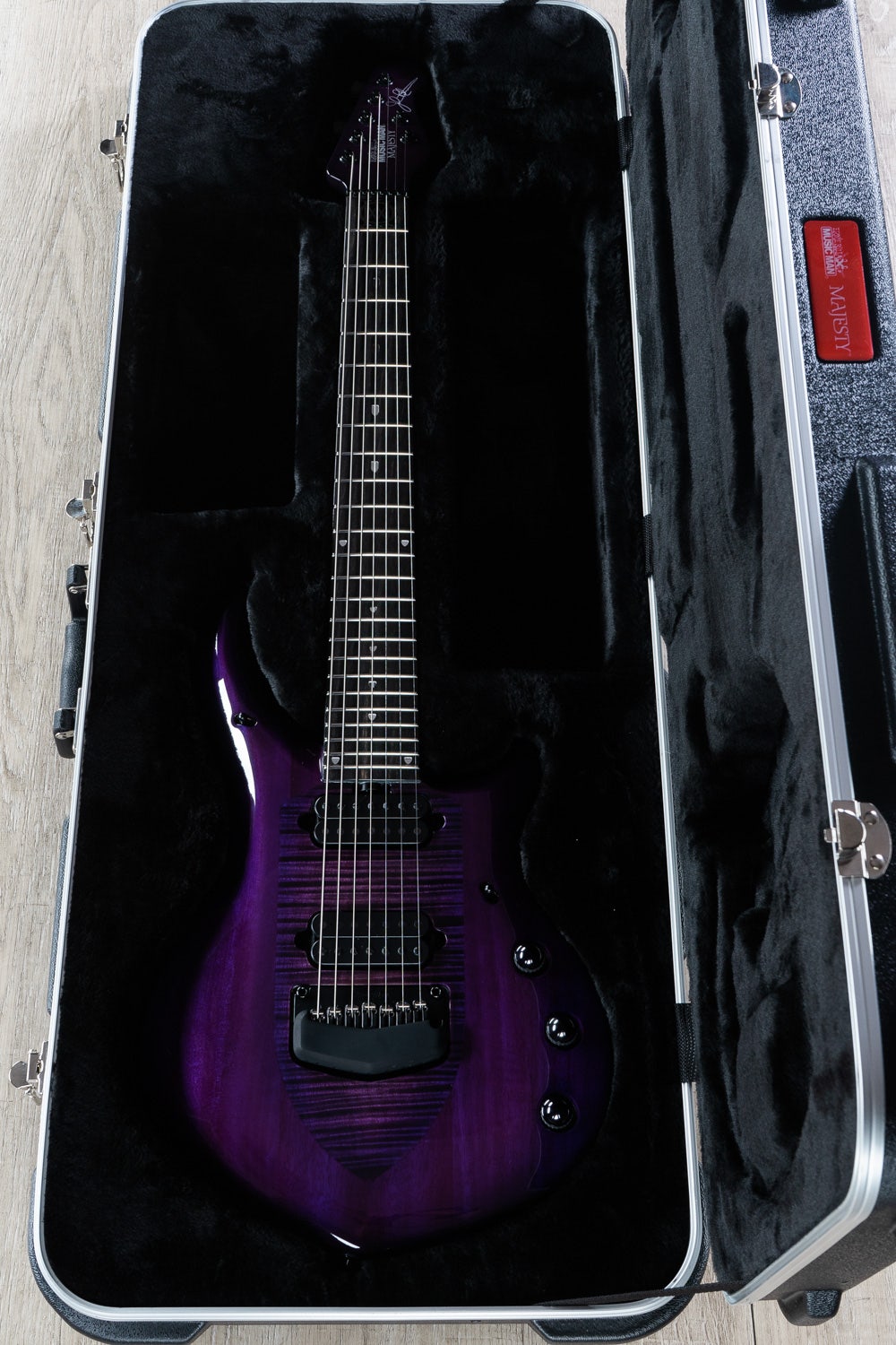 Ernie Ball Music Man Monarchy Series Majesty 7 - 7-String Electric Guitar, Ebony Fretboard, Hard Case - Majestic Purple